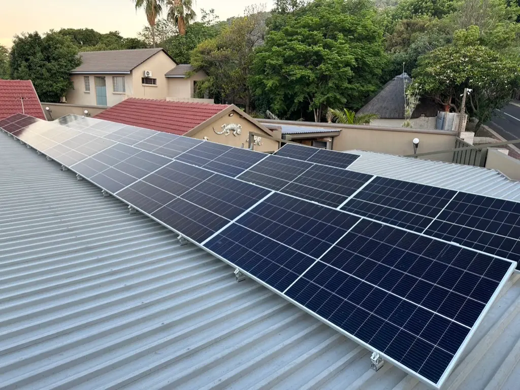 A row of panels on a tin roof